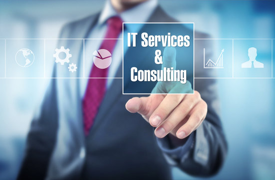 Team discussing IT consulting services in a modern Malaysia office environment